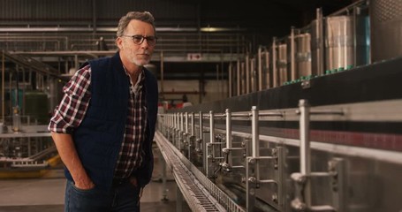 Male worker working at bottling plant