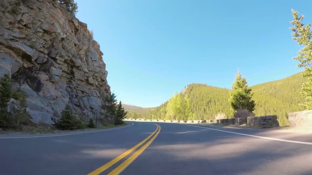 Time-lapse. POV point of view -  Driving on mountain highway in the Summer