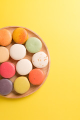 Colorful macaroons. Sweet macarons on retro  background .