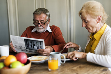 Senior Adult Couple Eat Breakfast