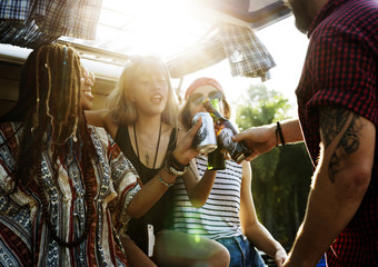 Friends Drinking Alcohol Beers Together on Road Trip Journey