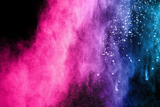 Color powder explosion on dark background.