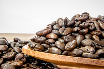 Roasted coffee beans on wooden plates