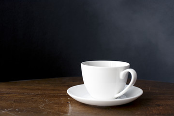 Closeup of coffee cup on wooden table