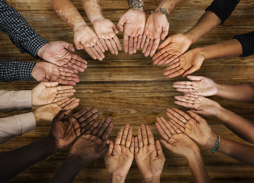 DIverse hands are together in a circle shape