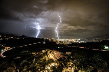 Lightning striking during a heavy storm over the city of city of Pereira, Colombia.