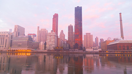 Manhattan skyline on a foggy morning, New York, USA. New York downtown near East River at dawn.