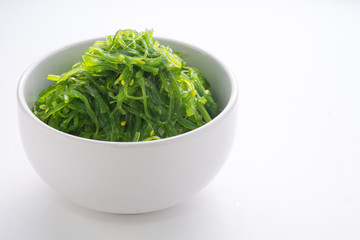 Hiyashi Wakame Chuka or seaweed salad in bowl on white background , Japanese food