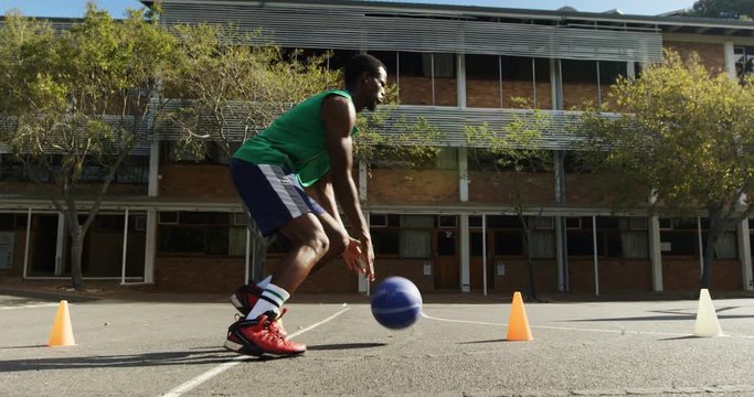 Basketball player practicing dribbling drill