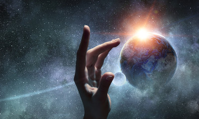Touching planet with finger