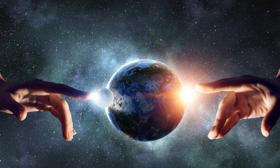 Touching planet with finger