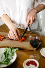 making pizza while drinking wine