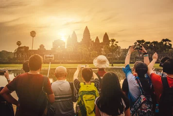 Tuinposter Tourist waiting for see the sunrise over Angkor Wat the largest religious temple in the world, One of the most famous UNESCO world heritage sites of Siem Reap in Cambodia. © boyloso