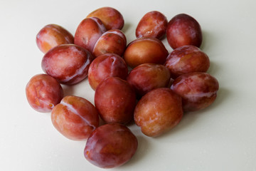 Vegan food. Fresh plum isolated on white background