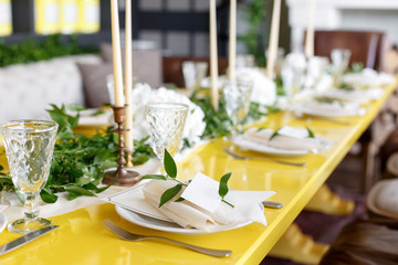 Candles and goblets on a decorated wedding table. selective focus