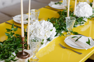 Candles and goblets on a decorated wedding table. selective focus