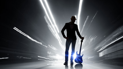 Fototapeta na wymiar Rock guy with guitar. Mixed media