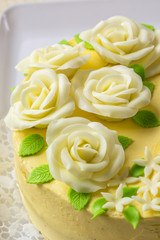 Butter yellow cake with marzipan roses.