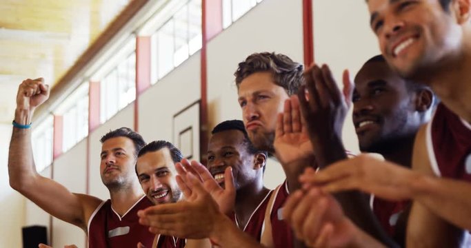 Excited African American Man Basketball Player Sitting On Bench And Cheering