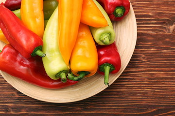Fresh colored sweet peppers on the plate