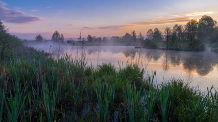 Obraz na płótnie Canvas Sunrise at morning lake,fog in mayday
