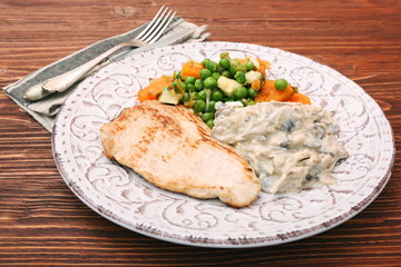 Turkey fillet with mushrooms in cream sauce and vegetables