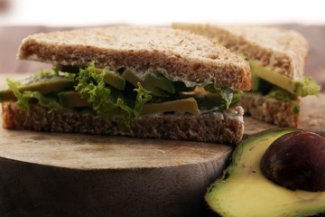 sliced avocado on toast bread with spices and avocado