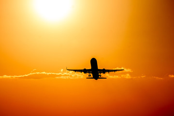 Plane on a bright sunset.