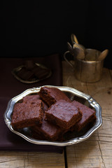 Chocolate brownies on a wooden table