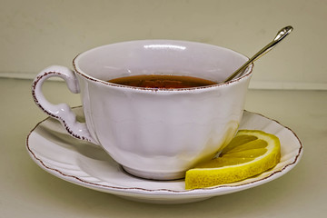 Tea cup with tea and a slice of lemon