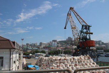 Fototapeta premium Industry, industry, port, work, marine crane, cityscape, object, harbor, cargo, work, sky, blue, clouds, buildings, buildings,