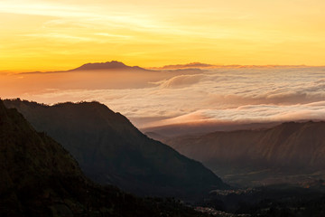 Twilight sunrise sky background over the mountain with foggy cloud landscape