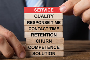 Businessman Building Service Concept With Wooden Blocks