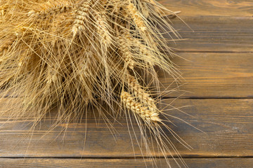 Wheat Ears on the Wooden Table