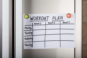 Workout Plan Paper Attached With Magnetic Thumbtacks © Andrey Popov