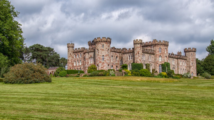 Fototapeta premium Country landscape showing an english castle standing in its grounds