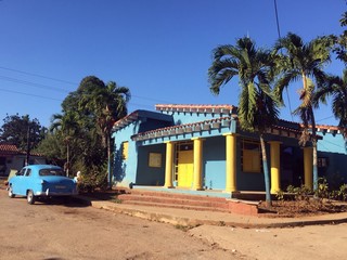 Colorful house and vintage car in Vinales