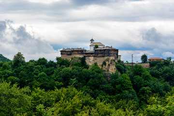 Fototapeta na wymiar Glozhene monastery - Easthern Orthodox monastery built on a mountain slope in Bulgaria