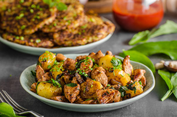 Potato pancakes, fried chicken with potatoes