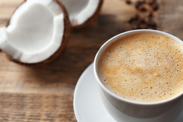 Cup of tasty coconut coffee, closeup