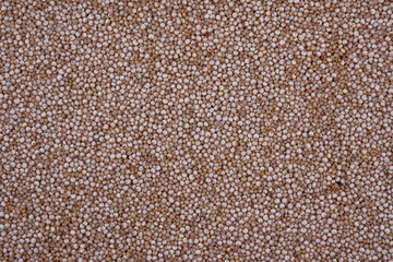 Organic quinoa seeds. Close up, background texture.