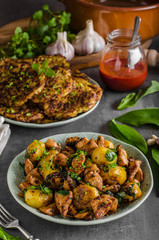 Potato pancakes, fried chicken with potatoes