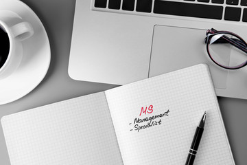Copybook, pen and laptop on grey background. Management concept