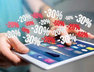 Sales promotion 20% 30% and 50% flying over an interface - Shopping concept
