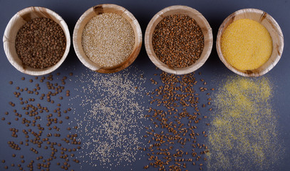 Four sorts of cereals in bowls.