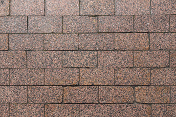 Obraz premium Granite masonry on the sidewalk