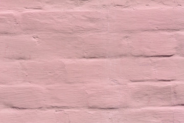 brick wall covered with pink lime