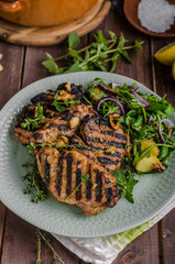 Grilled pork chops with lettuce salad
