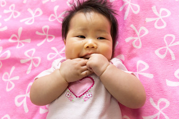 Portrait of a sian cute Infant baby girl (baby are three months)