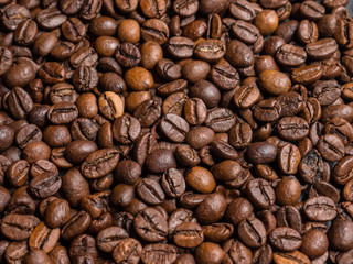 Roasted coffee beans on dark background. Selective focus.